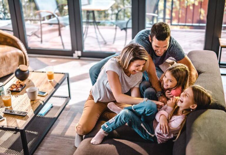 Parents tickling daughters