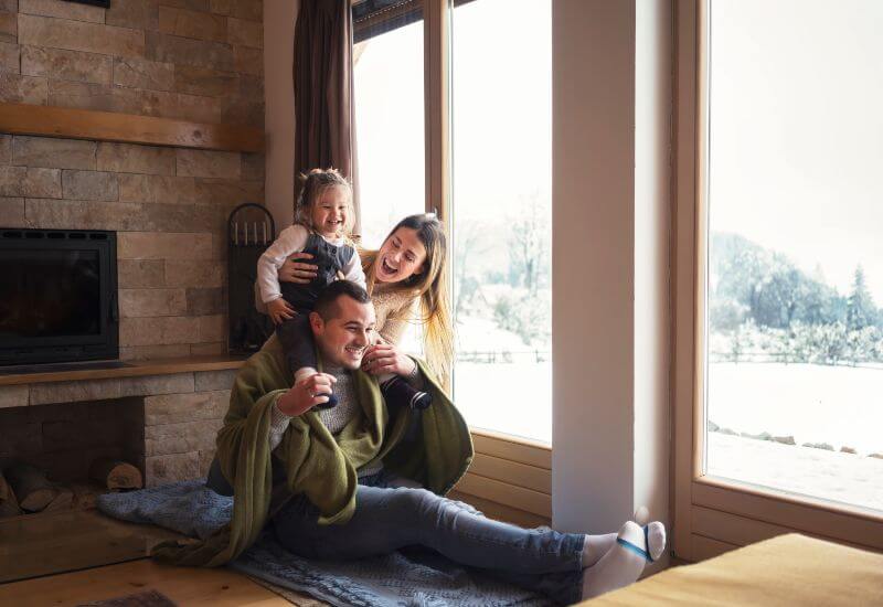 Family relaxing by window